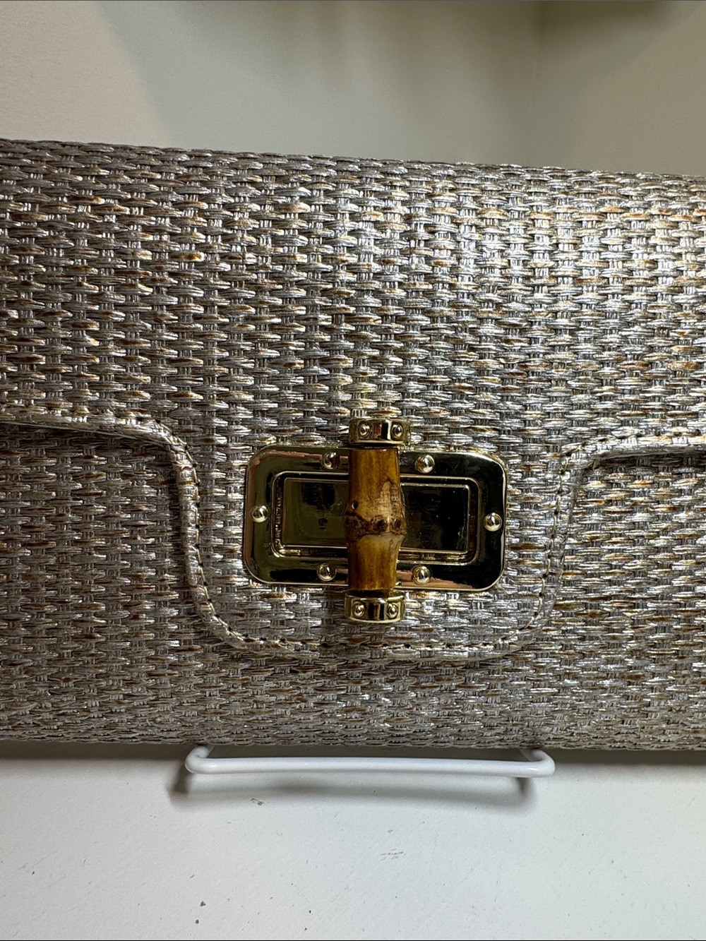 Unbranded woven silver/gold clutch with gold chain strap.